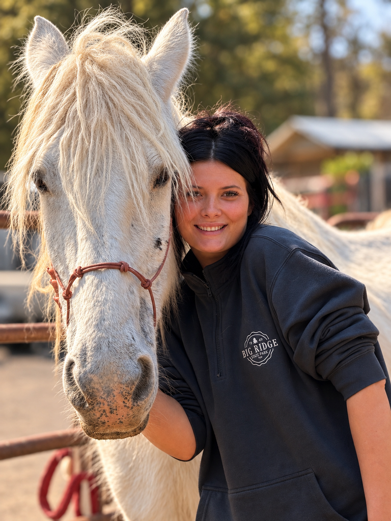 Luna-Bell beside a smiling Ranch caretaker.